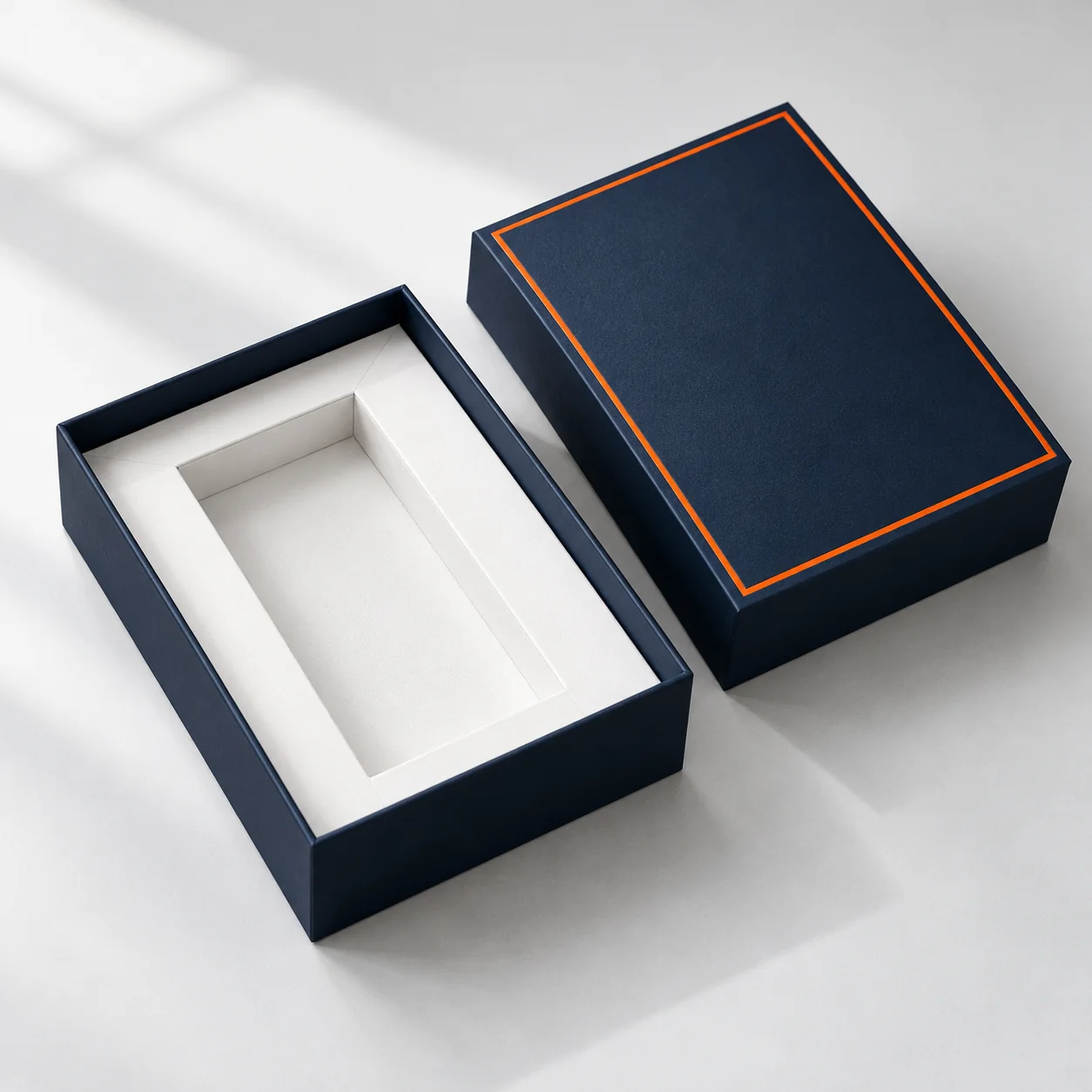 Navy rigid gift box with a separate lid and fitted white insert